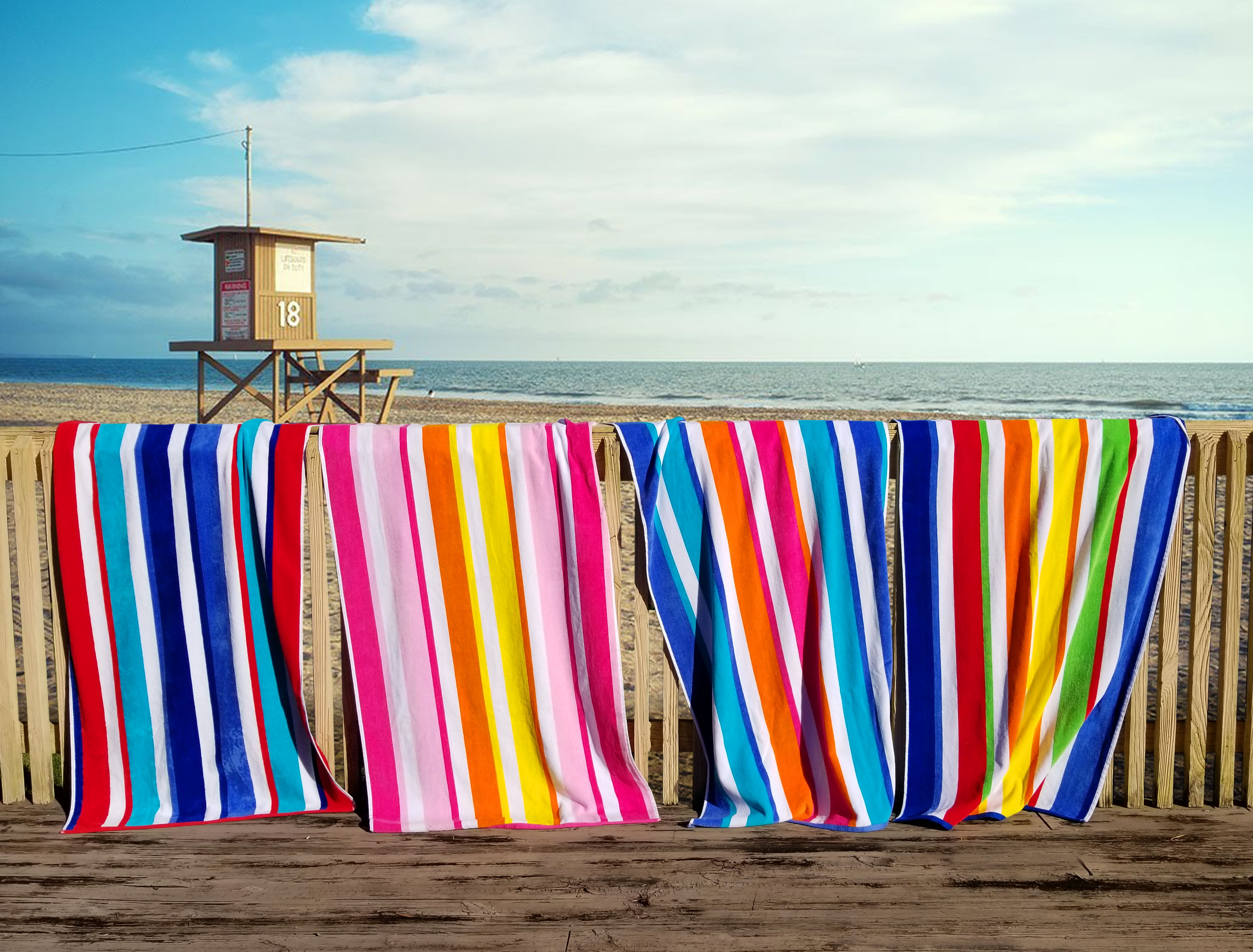 http://d3izeps273dd1j.cloudfront.net/images/blanks/cabana-striped-beach-towels-terry-velour-large%20-Soft-absorbent-bright-colors-100_%20cotton-Oversized-34x64-on-beach-fence.jpg